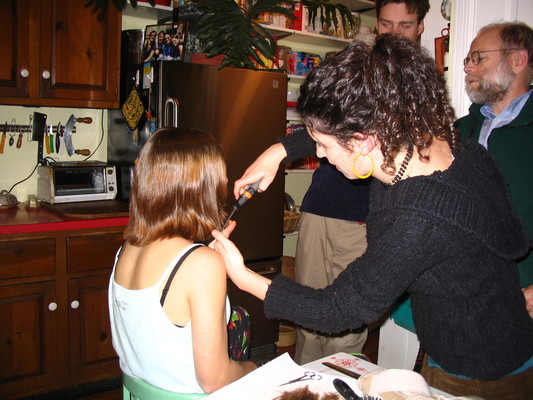 Rosie cutting Claire's hair