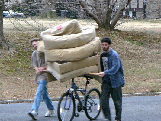 Chris and Jeff move a couch section